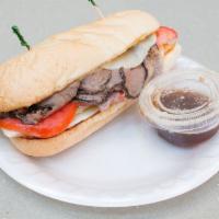 Grilled Roast Beef · Roast beef, melted provolone, lettuce, tomato and mayo on a garlic grilled french roll with ...