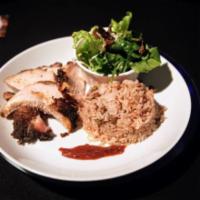 Jerk Pork · Slow spicy roasted pork served with rice and peas or pumpkin rice, sweet plantains, and gard...