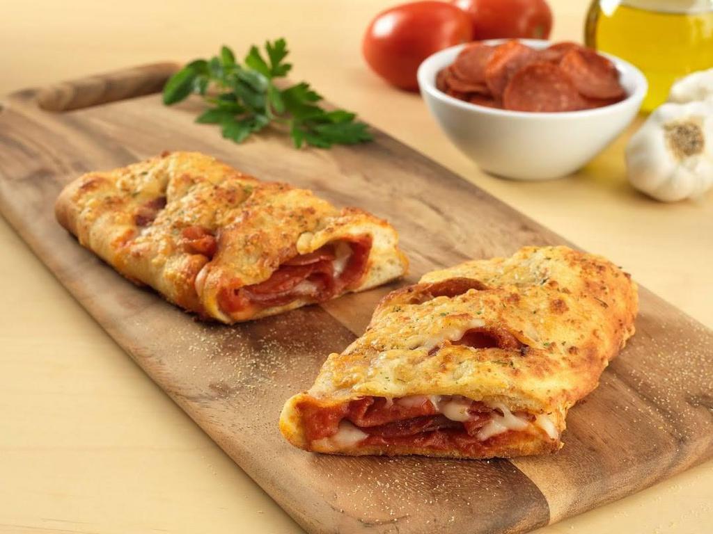 Create Your Own Calzone · Filled with your choice of 2 toppings and smoked provolone cheese and topped with Asiago, Romano. Served with marinara sauce for dipping.