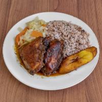 Brown Stew Chicken · Served with rice and peas or white rice and 2 sides.