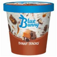 Blue Bunny Bunny Tracks Pint · Vanilla with chocolate peanut butter bunnies, chocolate-covered peanuts, caramel, and fudge ...