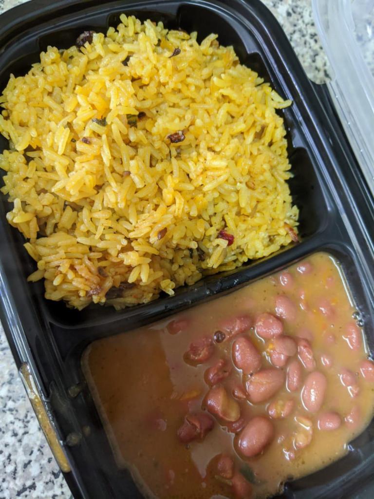 Arroz con Gandules Combo · A combination of rice with pigeon peas, cooked in the same pot with sofrito. 
This is Puerto Rico's national dish.
Served with a side of the Island's stewed beans