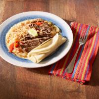 Steak Fajitas · Piled high on a sizzling skillet with sauteed onions and peppers, guacamole, cheese, pico de...