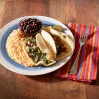 Street Tacos · Beef, chicken or carnitas, served open faced on two corn tortillas. Topped with cilantro, di...