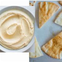 Hummus on Pita · Made from chickpeas, tahini paste, oil, garlic, lemon juice, and traditional spices. Served ...