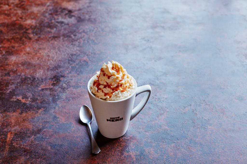 Caramel Latte · 2 shots of rich espresso, with steamed milk, a shot of caramel syrup, a layer of whipped cream, topped with caramel sauce.

