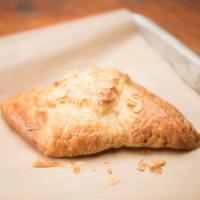 Almond Croissant · Almond paste wrapped in a f uplakey, buttery croissant.