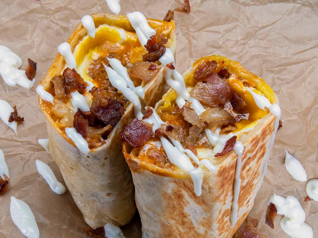 Borracho Burrito · 3 eggs, smoked bacon, haus chili, white American cheese, crispy tater tots, mayo; sides of mayo & hot sauce.