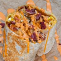 Pastrami Burrito · 3 eggs, pastrami, white American cheese, crispy tater tots, spicy mayo; sides of spicy mayo ...