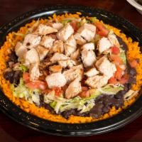Latin Grill and Chop ·  Chopped grilled breast, black beans, lettuce, and tomato over white rice.