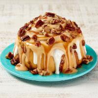 Caramel Pecanbon® · Warm dough, legendary Makara® Cinnamon, topped with caramel frosting, and pecans. Classic wi...