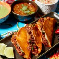 Quesabirrias  · Three dipped and griddled corn tortillas stuffed with cheese, onions, cilantro, original bra...