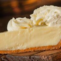 KEY LIME PIE · A tangy treat made with key limes and topped with fresh whipped cream.