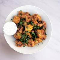 Gluten-Free and Vegan Creamy Sesame Cauliflower Wings · Cauliflower wings tossed in our creamy sesame sauce with house-made vegan ranch dressing.