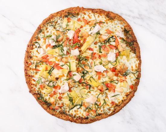 Gluten-Free Pesto Pizza · GF cauliflower crust with our delicious housemade Pesto sauce, artichokes, diced tomatoes, reduced fat mozzarella cheese, and fresh basil (add chicken for no additional charge).
