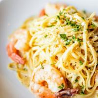 Shrimp Scampi · Linguine, shrimp, white wine, butter, shallots, garlic, lemon, pecorino cheese, and parsley.