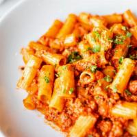 Rigatoni Bolognese · Rigatoni, six hour Bolognese and a touch of cream.