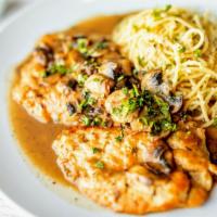 Chicken Marsala · Chicken breast in Marsala wine sauce with mushrooms and a side of spaghetti in olive oil and...