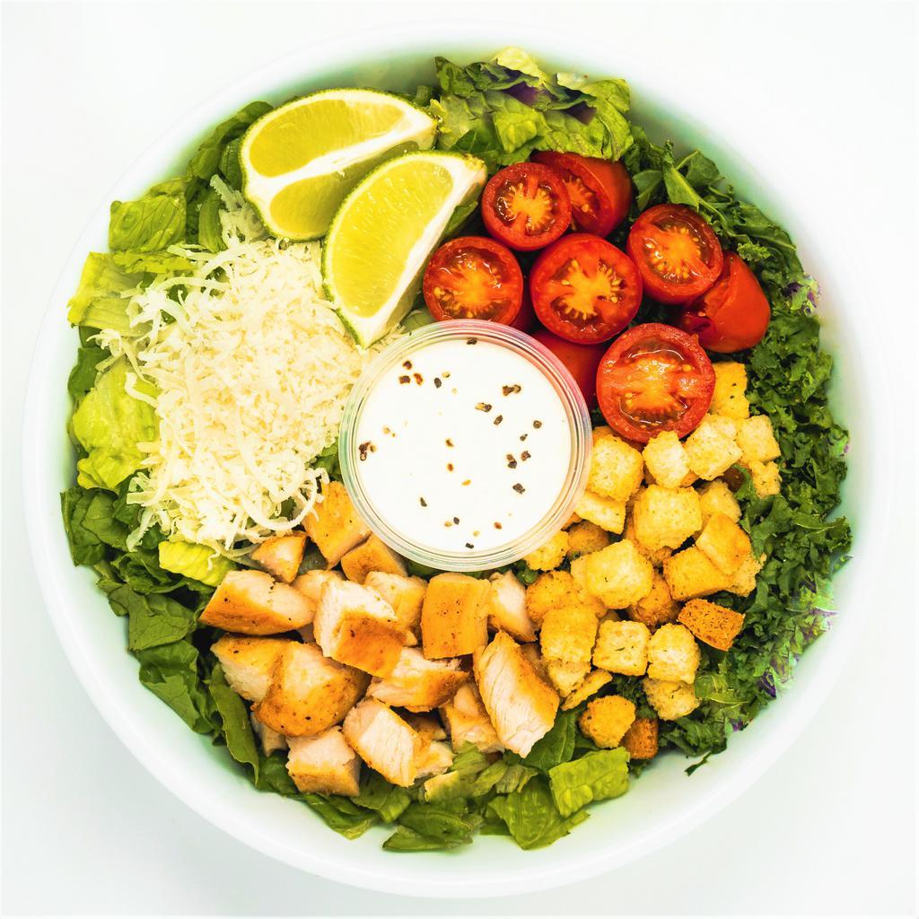 Kale Caesar · kale + romaine, grape tomatoes, parmesan cheese, croutons, roasted chicken, fresh lime + caesar dressing.