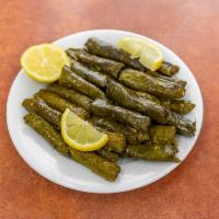 Grape Leaves Box · Grape leaves stuffed with rice, tomato, parsley, onions, olive oil, mint and lemon juice.