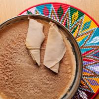 Injera (VG) · Classic Ethiopian flatbread. Contains gluten. We cannot make substitutions.