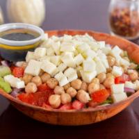 Chopped Salad · Romaine, iceberg, tomatoes, red onions, garbanzo beans and mozzarella cheese.