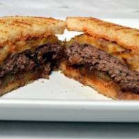 The Michigan Melt · Caramelized onion & cheese, Beyond Meat or Michigan grass-fed beef on sourdough bread
