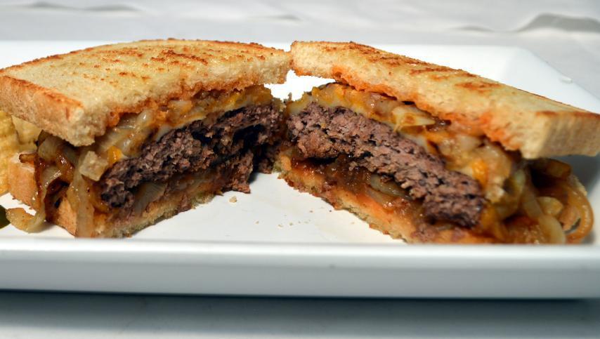 The Michigan Melt · Caramelized onion & cheese, Beyond Meat or Michigan grass-fed beef on organic sourdough bread