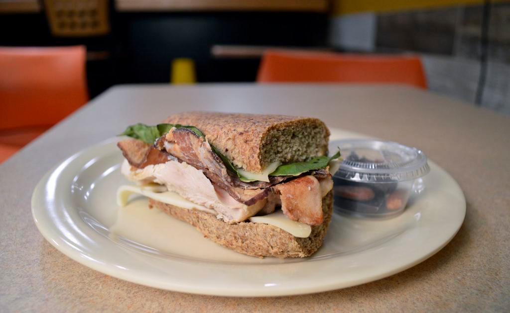 Keto Chicken & Bacon Sandwich · Made on Keto certified baguette with antibiotic free range chicken, bacon, avocado spread, and organic green leaf lettuce. It's Keto, Gluten-Free, Paleo, and Grain-Free.