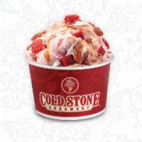 Our Strawberry Blonde · Strawberry ice cream with graham cracker pie crust, strawberries, caramel and whipped topping.
