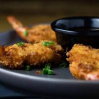 Coconut Shrimp · Coconut breaded shrimp served with sweet and sour sauce.