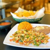 Huevos a la Mexicana · 2 scrambled eggs sauteed with diced jalapeno peppers, onions, and tomatoes. Served with rice...