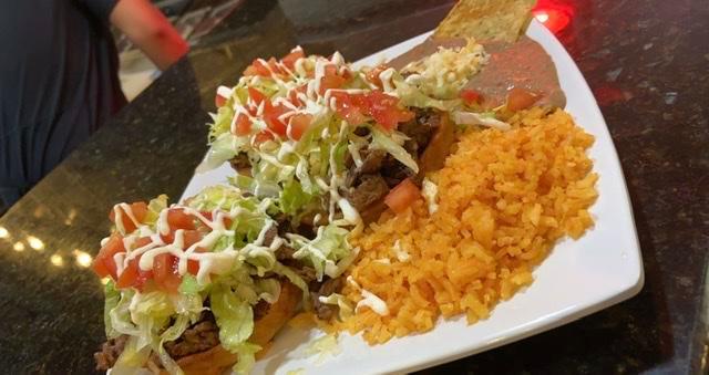 Sope Dinner · 3 sopes with your choice of steak, chicken, pork, chorizo, or ground beef. Topped with beans, lettuce, tomato, cheese, and sour cream. Served with rice and beans.