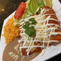 Enchilada Dinner · 3 soaked corn tortillas in red guajillo sauce or green sauce, filled with your choice of ste...