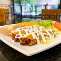 Flauta Dinner · 3 crispy rolled tortillas filled with chicken or steak. Served with rice, beans, salad, sour...