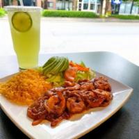 Camarones a La Diabla · Sauteed shrimp with onions and spicy sauce. Served with rice salad and fries