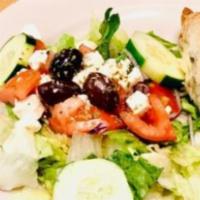 Greek Salad · Lettuce, tomato, red onions, feta cheese, pepperoncini, and olives.