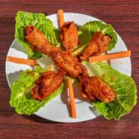 Chicken Wings  · Cooked wings of a chicken coated in sauce or seasoning. 