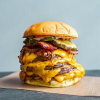 The Quad Burger · 4 patties, your call Creekstone Farms Beef or Impossible Foods (vegetarian) dusted with Pop'...