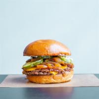 The Vegan Burger · 2 impossible patties, vegan secret sauce, pickles, caramelized onions, vegan American cheese...