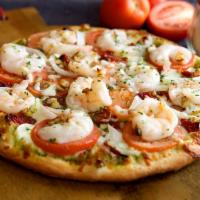 Pesto Lover's Gourmet Pizza · Shrimp, sun-dried tomato, roasted garlic, onions, tomato, parsley, and mozzarella cheese ove...