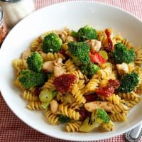 Rotini Chicken Tuscany · Rotini sauteed with chicken, broccoli, sun-dried tomato, fresh garlic, thyme, Parmesan and o...