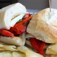 Veggie Eggplant Sandwich · Grilled eggplant, tomato, roasted red bell peppers, roasted garlic, basil and mozzarella che...