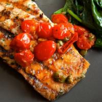 Salmon Florentine · Sauteed salmon served with pine nuts and capers over spinach with a lemon-butter sauce. Cont...
