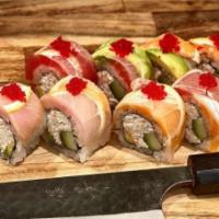 Rainbow Roll · Krab mix, cucumber, avocado, topped with an assortment of fish, lemon slices, and tobiko.