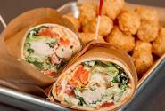 Grilled Chicken Ranch Wrap · Grilled chicken, romaine lettuce, cheddar-Jack cheese blend, tomatoes tossed in ranch dressi...