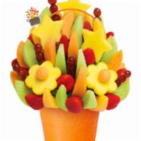 Delicious Celebration - Regular · Make any celebration even more delicious with one of our signature fresh fruit arrangements....