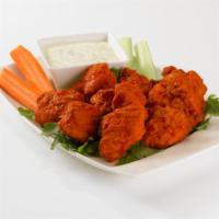Boneless Buffalo Bites · Hot and tangy Buffalo-style white chicken breast chunks with a cool bleu cheese dip to extin...