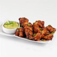 Chicken Wings · Fried to crispy perfection and tossed in your choice of Buffalo (Cal. 90) or sweet Thai chil...