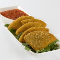 MozzaMia! Mozzarella Triangles · Delicately fried breaded triangles stuffed with Italian cheeses and served with a warm marin...